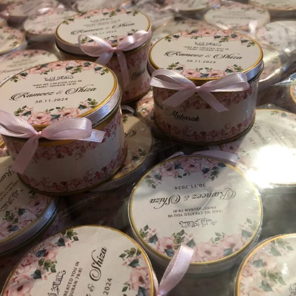 Round tin box with ribbon